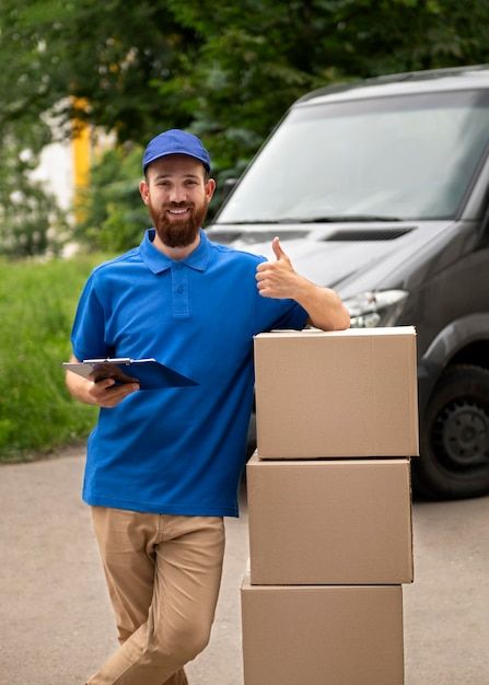 free photo medium shot delivery man with boxes free photo medium shot delivery man with boxes